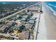 Aerial view of beachfront homes and condos along a sandy beach with ocean and coastline at 4325 S Atlantic Ave # C10, New Smyrna Beach, FL 32169