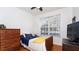 Cozy bedroom with wood floors, a large window, and a ceiling fan at 4527 Sunset Ln, Oviedo, FL 32765