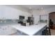Modern kitchen featuring white cabinets, stainless steel appliances, and quartz countertops at 4527 Sunset Ln, Oviedo, FL 32765