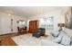 Bright living room with hardwood floors, comfortable seating, and a large window at 4527 Sunset Ln, Oviedo, FL 32765