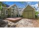 Exterior view of backyard featuring a deck and detached garage, providing ample space for outdoor activities at 501 Sheridan Blvd, Orlando, FL 32804
