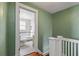 Bright bathroom with a vintage vanity, tub with shower, tiled floors, and a mosaic tile accent stripe at 501 Sheridan Blvd, Orlando, FL 32804