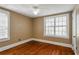 Sunlit bedroom with hardwood floors and a ceiling fan at 501 Sheridan Blvd, Orlando, FL 32804