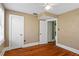 Bedroom with hardwood floors, white trim, and neutral walls at 501 Sheridan Blvd, Orlando, FL 32804