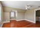 Bedroom featuring angled ceilings, hardwood floors, a ceiling fan, and natural light at 501 Sheridan Blvd, Orlando, FL 32804