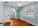 Bedroom with hardwood floors, a ceiling fan, and two windows that provide natural light at 501 Sheridan Blvd, Orlando, FL 32804