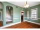 Dining Room featuring hardwood floors and arched doorways at 501 Sheridan Blvd, Orlando, FL 32804