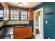 Galley kitchen with stainless steel sink and a view through the side door to the backyard at 501 Sheridan Blvd, Orlando, FL 32804