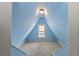 Cozy carpeted room with blue walls, natural light, and a pendant light at 501 Sheridan Blvd, Orlando, FL 32804