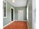 Bright sun room with mosaic tile flooring and large windows, providing ample natural light and exterior door at 501 Sheridan Blvd, Orlando, FL 32804