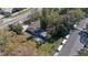 An aerial view showcases the home's location near a road and the surrounding neighborhood at 5150 Old Howell Branch Rd, Winter Park, FL 32792