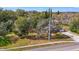 Aerial perspective of the house showcasing the lot, driveway, and mature trees at 5150 Old Howell Branch Rd, Winter Park, FL 32792