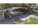 A partial aerial view showing an outdoor carport area next to the house and driveway at 5150 Old Howell Branch Rd, Winter Park, FL 32792
