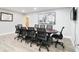 Modern conference room featuring a large table, comfortable chairs, and contemporary artwork at 5150 Old Howell Branch Rd, Winter Park, FL 32792