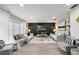 A bright, modern living room with stylish furniture, sleek flooring, and neutral decor at 5150 Old Howell Branch Rd, Winter Park, FL 32792