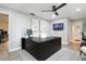 Bright office space with gray walls, modern art, a large black desk and neutral carpet at 5150 Old Howell Branch Rd, Winter Park, FL 32792