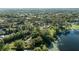 Breathtaking aerial shot showcasing a lakefront property nestled among beautiful greenery at 5203 Pineview Way, Apopka, FL 32703