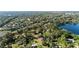 The property boasts an expansive plot of land, complemented by a serene lake at 5203 Pineview Way, Apopka, FL 32703