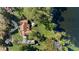 Aerial view of a brick home on a large lot with a gazebo next to a tranquil lake at 5203 Pineview Way, Apopka, FL 32703