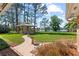Backyard featuring brick patio, outdoor brick kitchen with a lovely view of the lake and lush trees at 5203 Pineview Way, Apopka, FL 32703