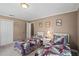 The cozy bedroom includes twin beds with matching patchwork quilts at 5203 Pineview Way, Apopka, FL 32703