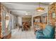 Bright breakfast nook features brick accents and connects to the kitchen and Gathering room at 5203 Pineview Way, Apopka, FL 32703