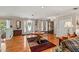 Inviting foyer with hardwood floors, a decorative rug, and views into other living spaces at 5203 Pineview Way, Apopka, FL 32703
