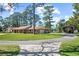 Charming single-story home with a well-manicured front yard, long driveway, and car port at 5203 Pineview Way, Apopka, FL 32703
