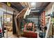 Spacious garage interior, featuring a tractor, workshop area, and ample storage at 5203 Pineview Way, Apopka, FL 32703