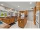 Bright kitchen showcases ample cabinets, stainless steel appliances, and a functional center island at 5203 Pineview Way, Apopka, FL 32703