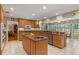 Bright kitchen features a center island, granite countertops, and lots of cabinet space at 5203 Pineview Way, Apopka, FL 32703