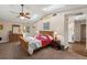 Main bedroom with a skylight and attached bathroom at 5203 Pineview Way, Apopka, FL 32703