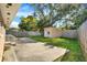 Backyard with shed, patio, fencing and mature shade trees at 5715 Satel Dr, Orlando, FL 32810