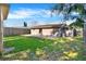 Spacious backyard with lush green grass and a concrete patio, perfect for outdoor entertaining at 5715 Satel Dr, Orlando, FL 32810