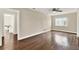 Bright bedroom featuring hardwood floors and neutral wall color at 5715 Satel Dr, Orlando, FL 32810