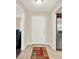 Inviting foyer features neutral walls and a colorful welcome mat at 5715 Satel Dr, Orlando, FL 32810
