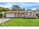 Charming single-story home with a well-maintained lawn and inviting curb appeal at 5715 Satel Dr, Orlando, FL 32810