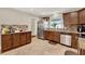 Kitchen with stainless steel appliances, granite countertops, and tile flooring at 5715 Satel Dr, Orlando, FL 32810