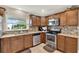 Well-equipped kitchen with stainless steel appliances and granite countertops at 5715 Satel Dr, Orlando, FL 32810