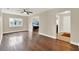 Open-concept living area featuring hardwood floors and ample natural light at 5715 Satel Dr, Orlando, FL 32810