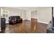 Spacious living room featuring gleaming hardwood floors and neutral wall color at 5715 Satel Dr, Orlando, FL 32810