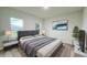 Modern bedroom featuring stylish furniture, soft lighting, and a calming color scheme at 656 Marion Oaks Mnr, Ocala, FL 34473