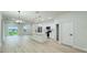 Bright, open kitchen with an island and modern appliances, flowing into a spacious living area at 656 Marion Oaks Mnr, Ocala, FL 34473
