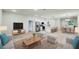 Spacious living area with contemporary design, an open layout and adjacent kitchen at 656 Marion Oaks Mnr, Ocala, FL 34473