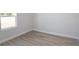 A bright bedroom with a large window and modern baseboards at 656 Marion Oaks Mnr, Ocala, FL 34473