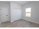 Well-lit bedroom featuring a closet, window with view, and neutral paint at 656 Marion Oaks Mnr, Ocala, FL 34473