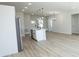 Open-concept kitchen boasts an island with seating and modern pendant lighting at 656 Marion Oaks Mnr, Ocala, FL 34473