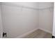 A large walk-in closet, offering ample storage space with durable wood-look flooring at 656 Marion Oaks Mnr, Ocala, FL 34473