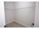 A large walk-in closet, offering ample storage space with durable wood-look flooring at 656 Marion Oaks Mnr, Ocala, FL 34473