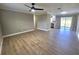 Spacious living room features modern vinyl floors, crown molding, and bright natural light at 6809 Gallo Ct, Orlando, FL 32810